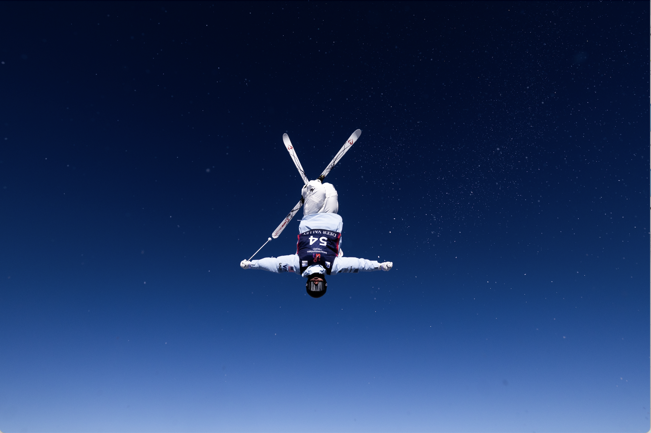 Inverted Freestyle Mogul Skier with Skis Crossed