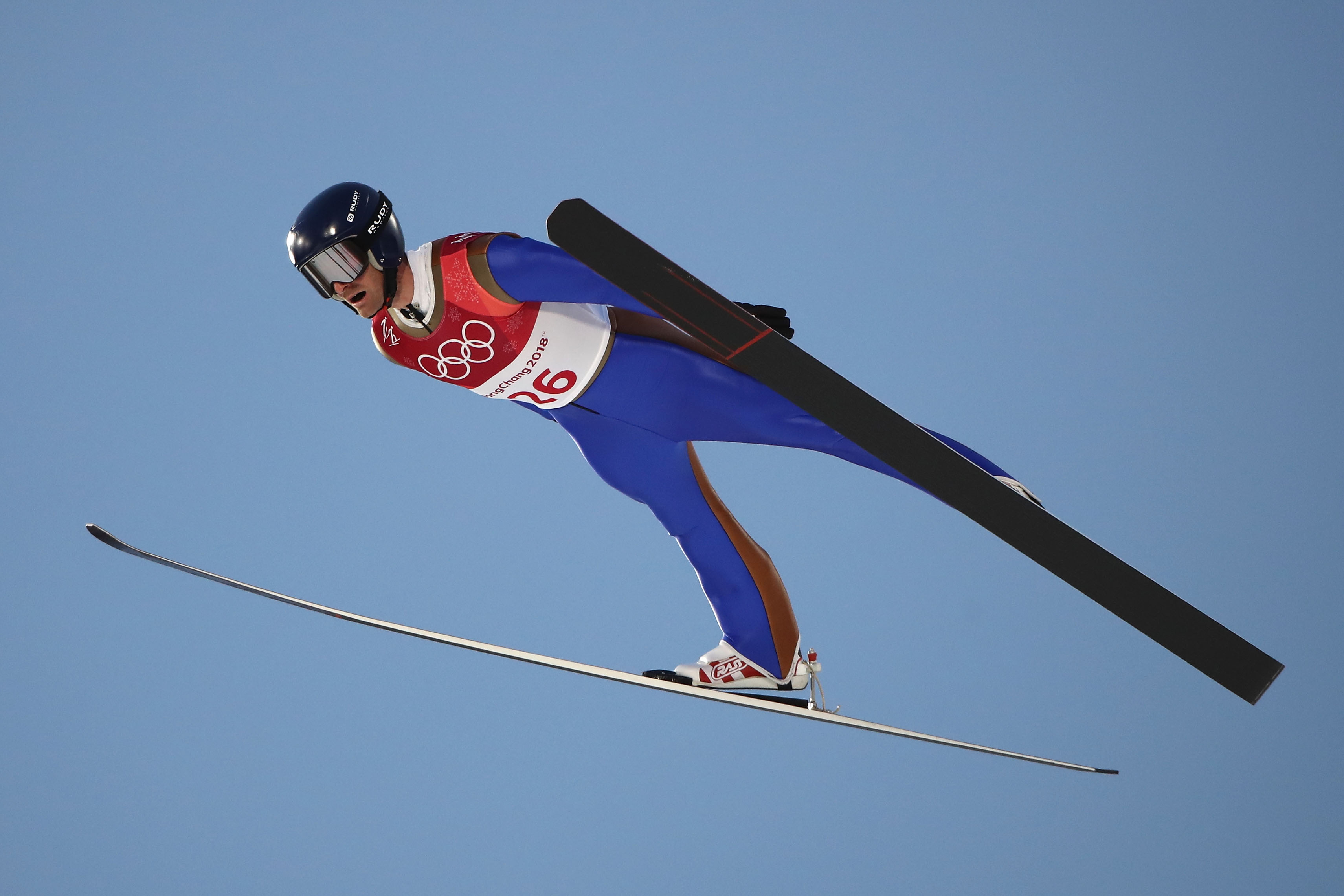 Competing in his final Olympic event, Bryan Fletcher led his young teammates in the large hill team event Thursday. (Getty Images - Clive Mason)