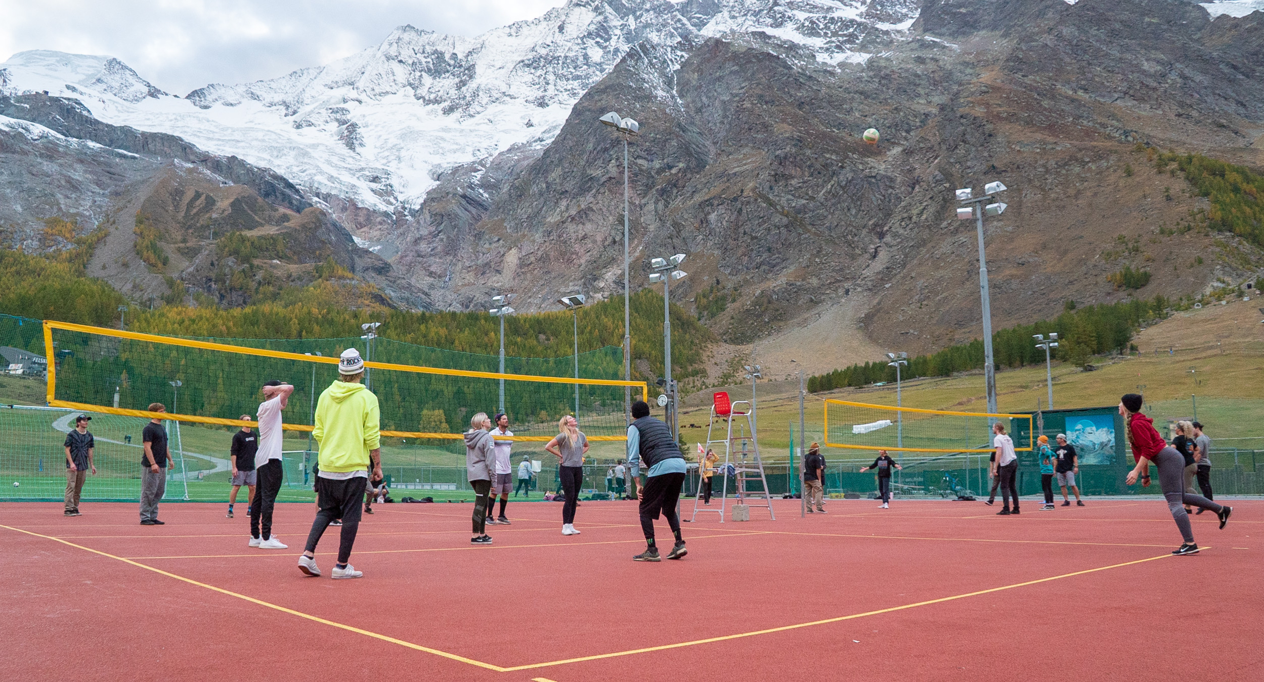 Members of the U.S. Freeski, Snowboard, and Snowboardcross Team playing volleyball after a day on the mountain in Saas-Fee, Switzerland. (U.S. Ski & Snowboard) volleyball in switzerland