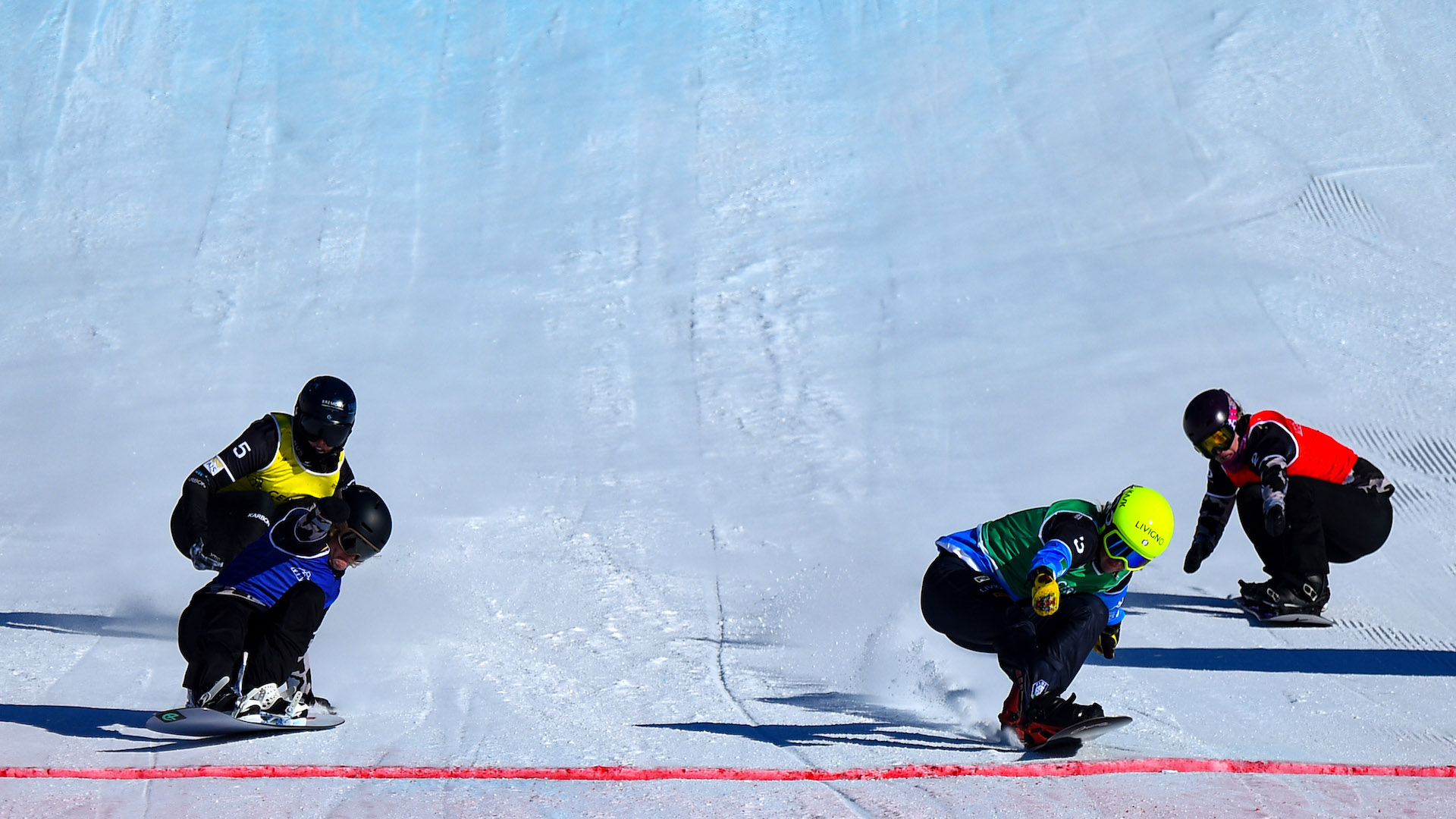 four SBX riders cross the finish line. 
