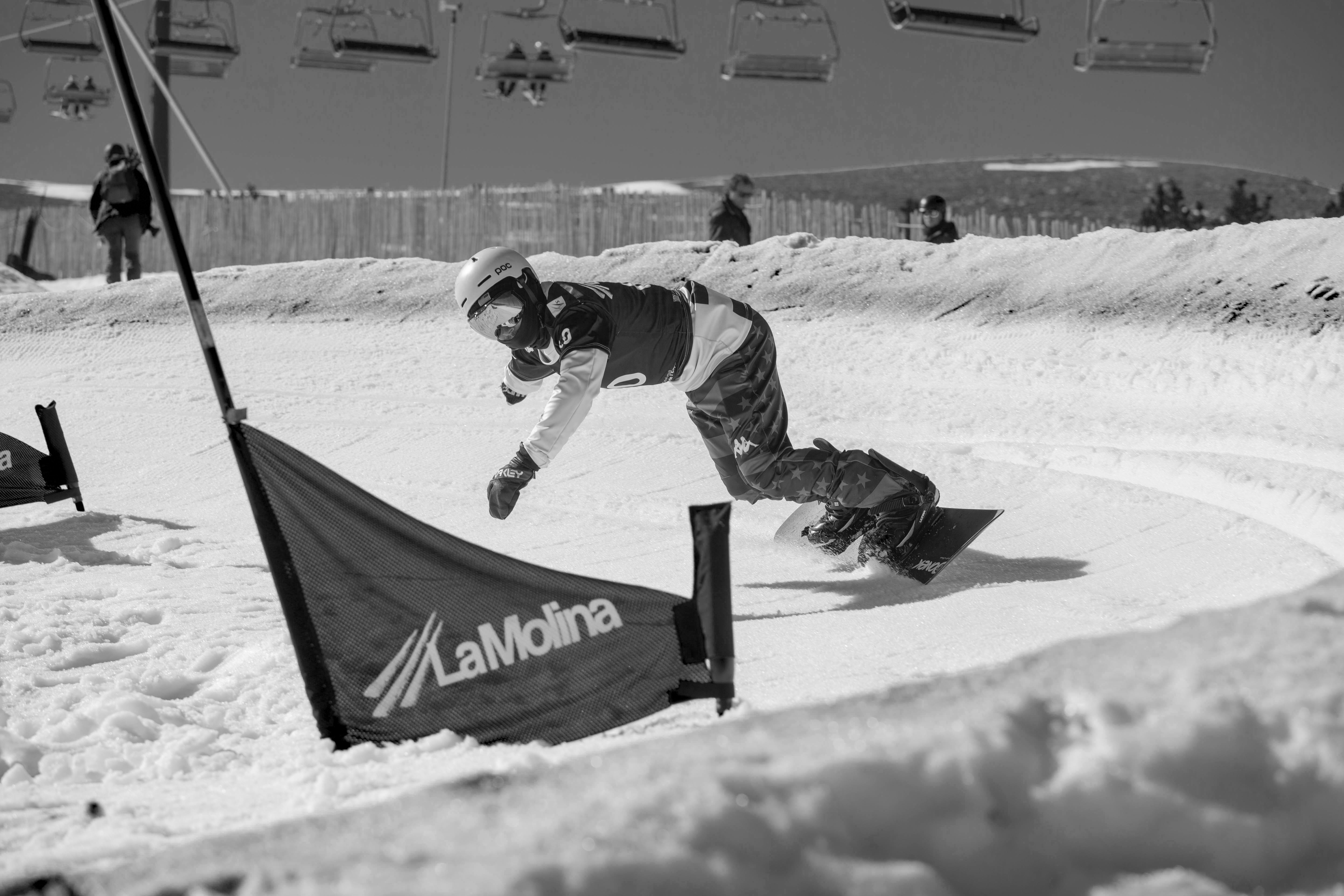 Mike Minor competes in the dual banked slalom team event at the 2023 Para Snowboard World Championships in La Molina, Spain