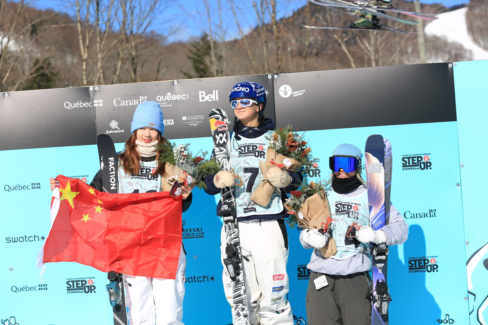 Rell Harwood on the podium with winner Flora Tabanelli and runner up Ruyi Yang
