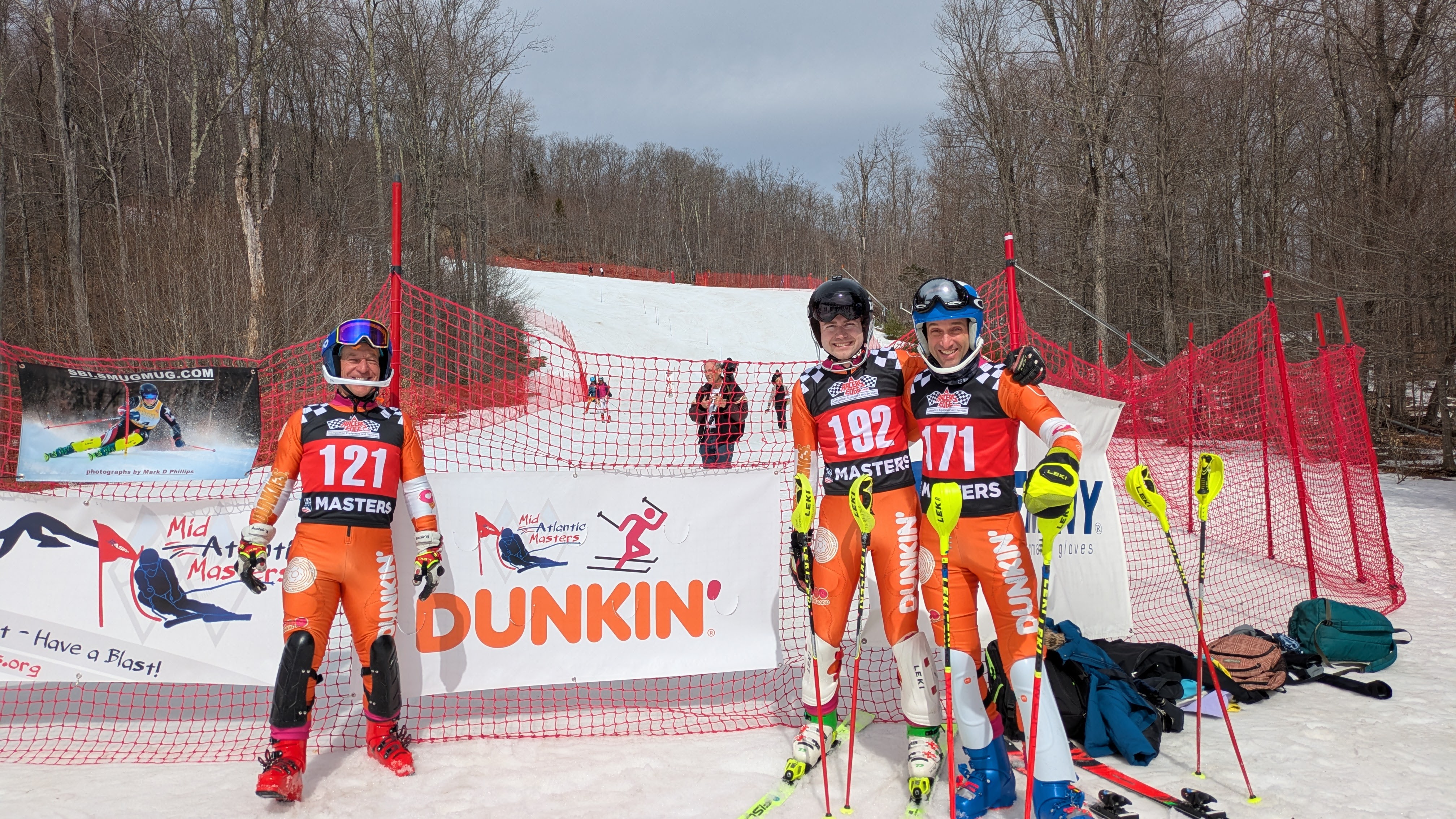 Dunkin' Sponsor Banner with  U.S. Ski & Snowboard Masters racers at the 2025 Gore Nationals