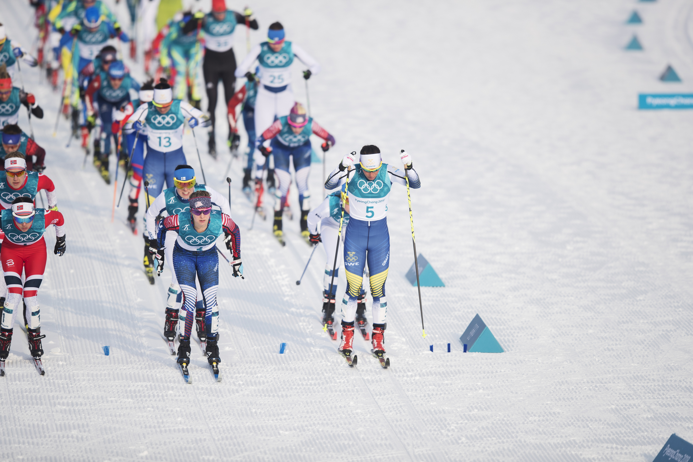 Charlotte Kalla of Sweden and Jessica Diggins lead the start of the skiathlon Saturday in Pyeongchang-gun, South Korea. (Getty Images - Nils Petter Nilsson)