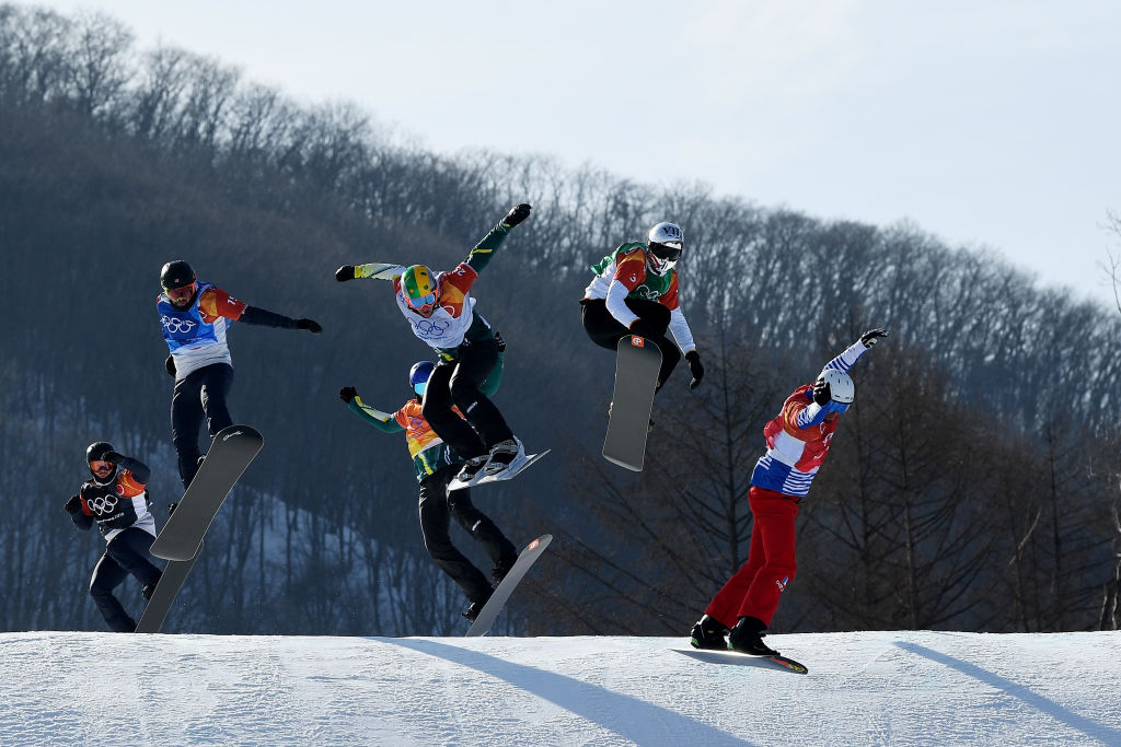 Pierre Vaultier of France (red), Jarryd Hughes of Australia (white), Regino Hernandez of Spain (green), Nick Baumgartner  (blue), Mick Dierdorff (black) and Alex Pullin of Australia (yellow) compete during the snowboardcross big final Thursday.. (Getty Images - David Ramos)