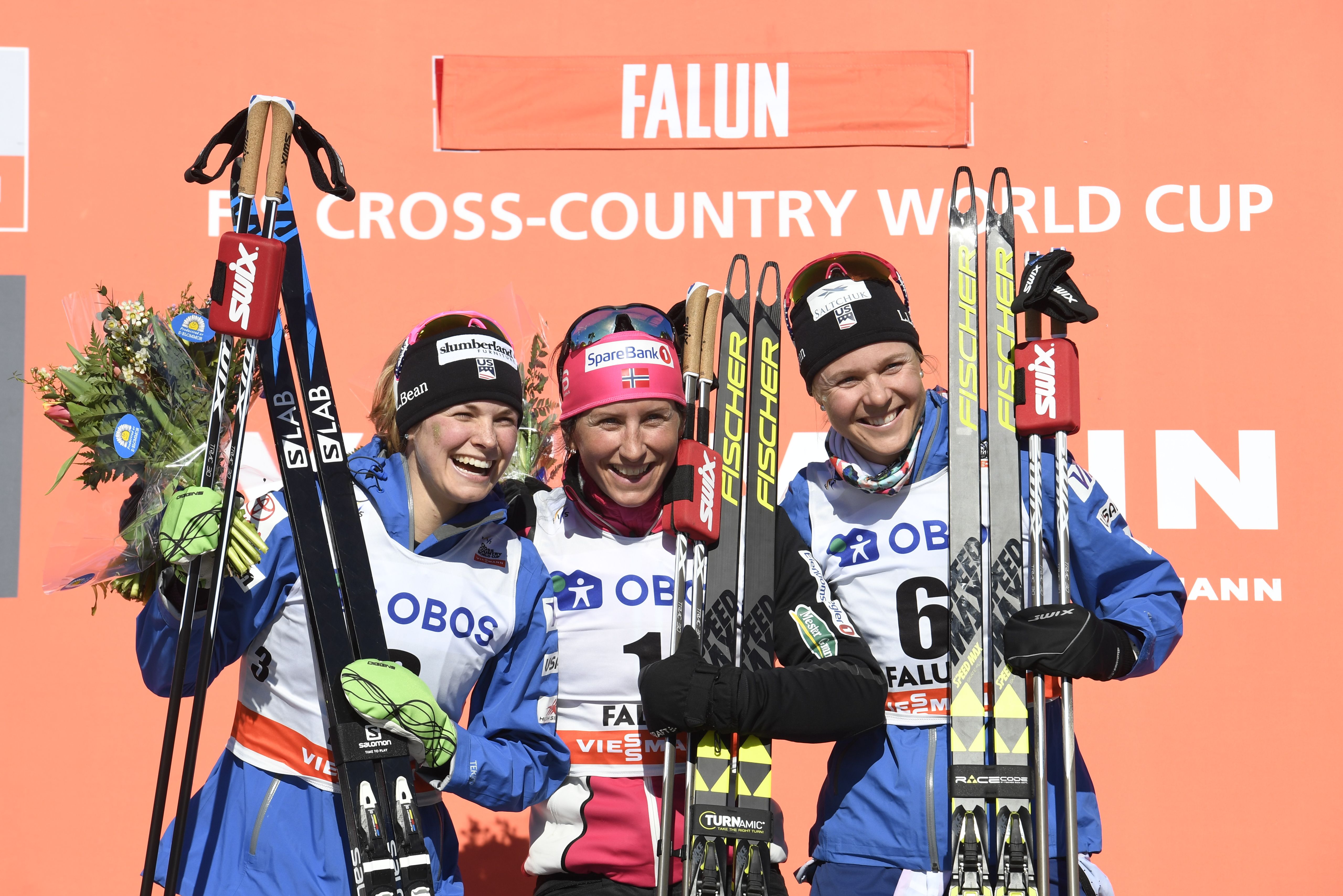 Jessica Diggins and Sadie Bjornsen join Marit Bjoergen of Norway on the podium after Sunday's final 10k pursuit of the season in Falun, Sweden. (Getty Images/AFP - Ulf Palm)