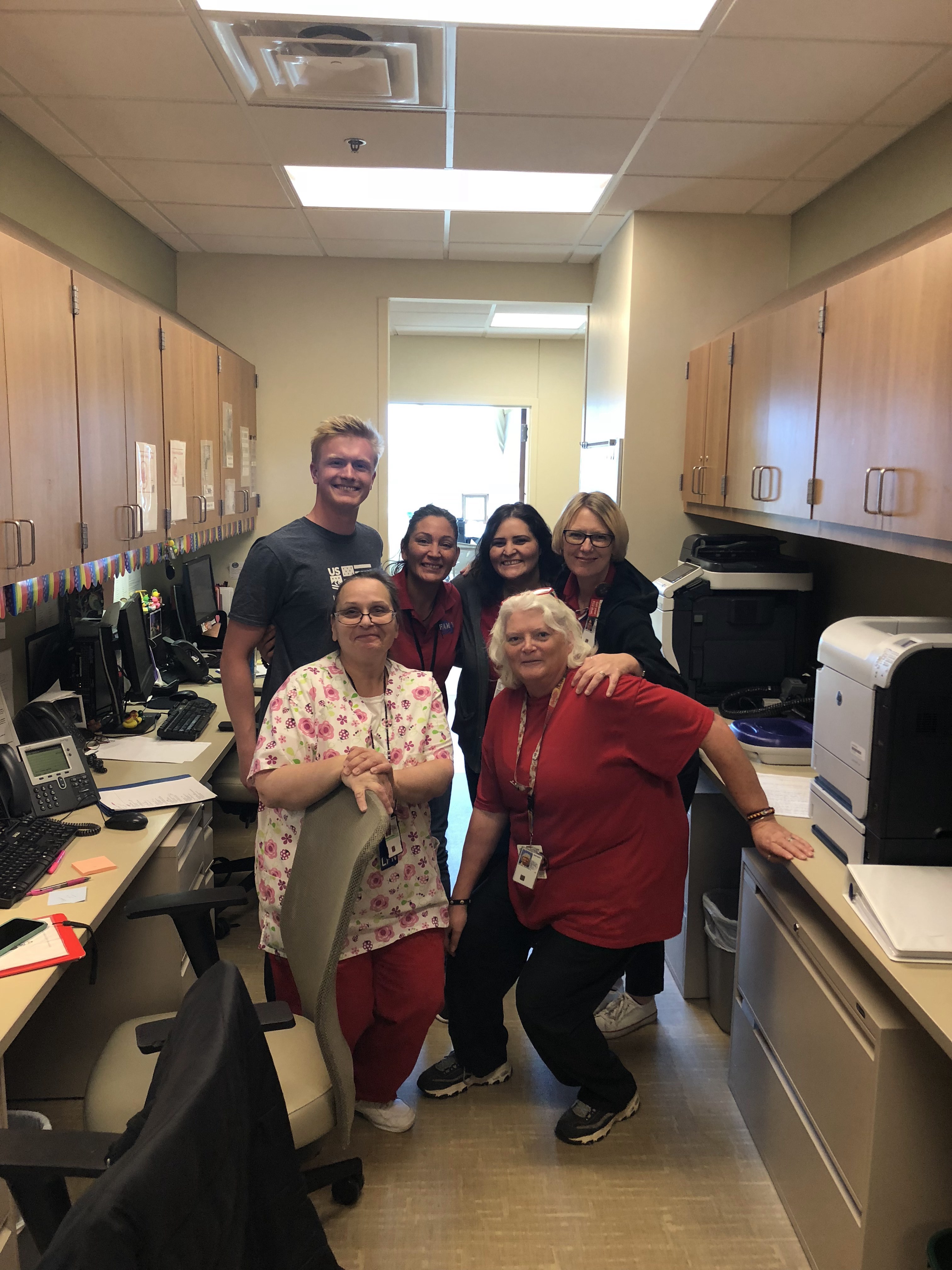 Jason Wolle with medical staff at VA in Fort Carson.