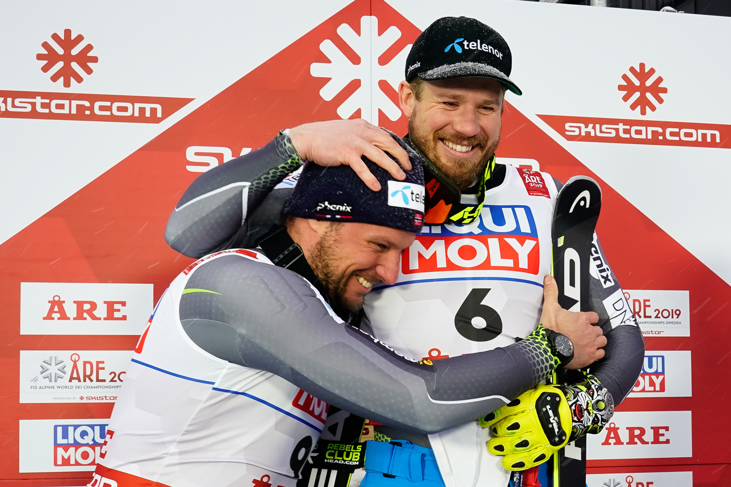 Aksel Lund Svindal shares the podium with teammate Kjetil Jansrud