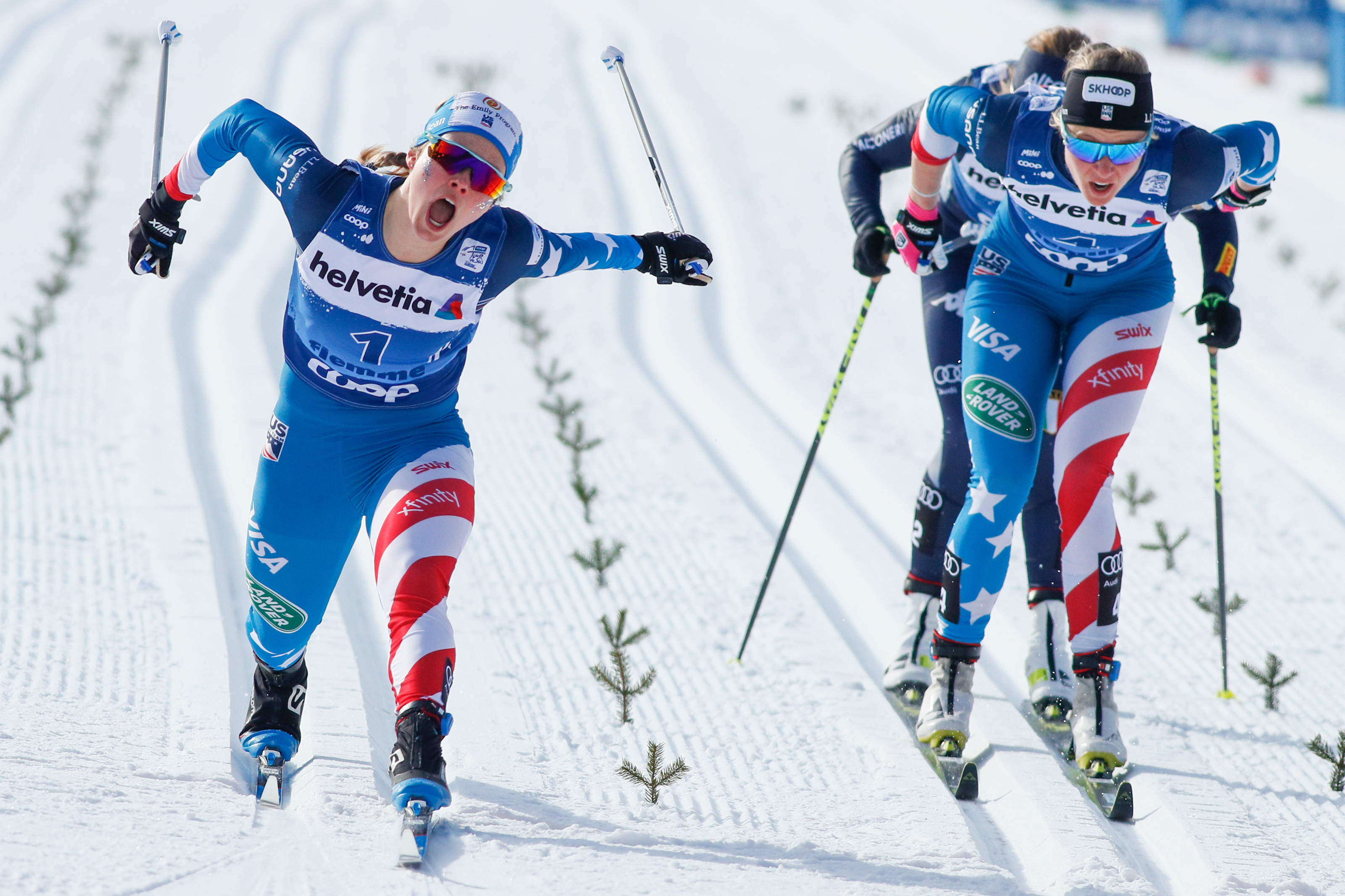 Jessie Diggins crosses the line in third as Sadie Maubet Bjornsen finishes fourth at the FIS Cross Country World Cup classic sprint January 4, 2020 in Val Di Fiemme, Italy. (Getty Images/Agence Zoom - Laurent Salino)