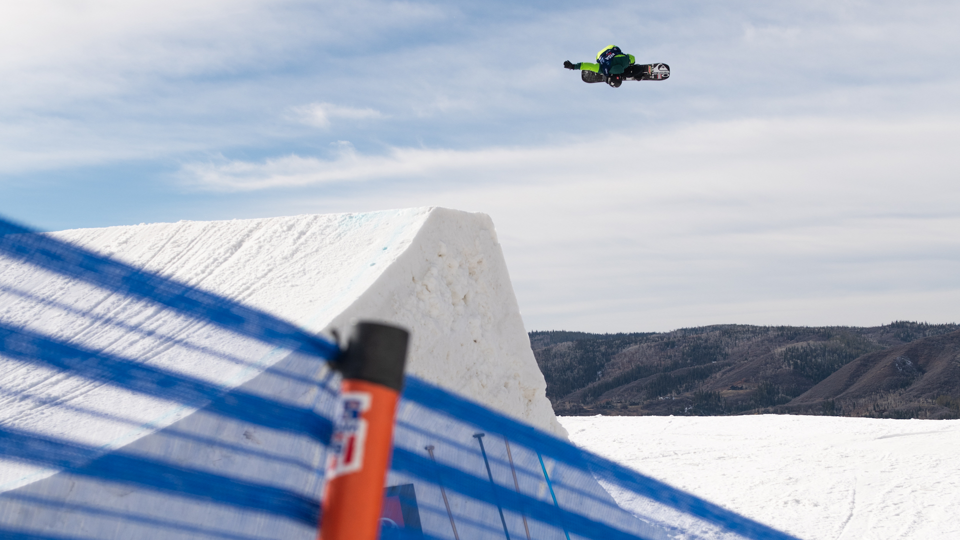 Red Gerard spins in the air off the jump lip.