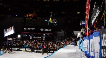 David Wise airborne at Mammoth Mountain Ski Area at night.