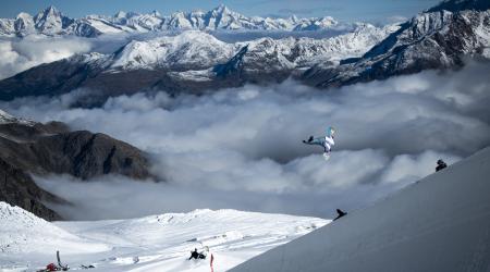 A snowboarder airs out of the halfpipe in Saas Fee. 