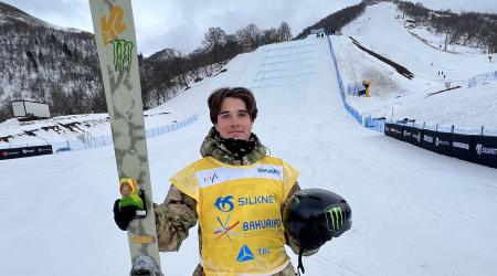 Troy Podmilsak stands in front of the Big Air jump. 