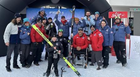 The team celebrating on the podium in Santa Caterina